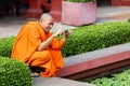 A buddhist monk taking a picture at the National Museum of Cambodia in Phnom Penh