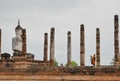 Buddhist monk taking pictures at Wat Mahathat, Sukhothai Thailand.