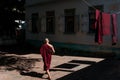 Buddhist Monk Walking Outdoors 