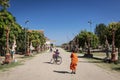 Buddhist monk walking outside Wat Svay Andet Pagoda in Kandal Province Cambodia