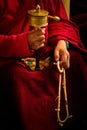 Buddhist monk and wheel, Dalai Lama temple, McLeod Ganj, India