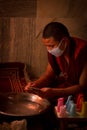 Buddhist Monks from Bhutan make candles in their Bhutan Temple i