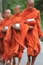 Buddhist monks carrying food bowls, Cambodia