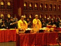 Buddhist monks during a ceremony at the Buddha`s Tooth Relic Temple in Singapore Royalty Free Stock Photo