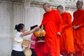 Buddhist monks collecting alms in the morning.