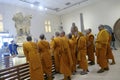 Buddhist monks examine sculptures at Sarnath