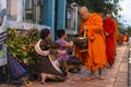 Buddhist monks getting alms