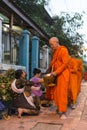 Buddhist monks getting alms