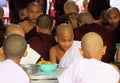 MANDALAY, MYANMAR - DECEMBER 18. 2015: Buddhist monks having breakfast at Mahagandayon Monastery