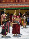Buddhist Monks and Ladakhi masked performers during the annual Hemis festival in Ladakh, India