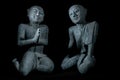 Buddhist monks in peaceful meditation. Traditional vintage Thai buddhism statues