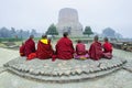 Buddhist monks pray at the historical Buddhist holy site Sarnath in India.