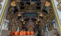 Buddhist Monks praying and pay respect Buddha statue at Wat Pariwas