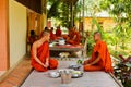 Buddhist monks of a riverside temple in Kampot, Cambodia