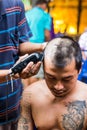 Buddhist monks shave their hair to be ordained Royalty Free Stock Photo