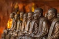 Buddhist monks statues symbol of peace and serenity at Wat Phu Tok temple, Thailand, asceticism and meditation, buddhist art work