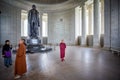 Buddhist monks studying statue of Thomas Jefferson in the Jefferson Memorial in Washington DC, USA