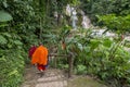 Buddhist monks visiting the Kuang Si waterfalls, near Luang Prabang, Laos