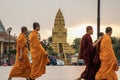 buddhist monks walk near Wat Ounalom, a famous historical site in Phnom Penh