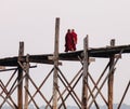 Buddhist monks walking on the bridge in Myanmar