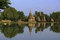 Buddhist monks walking reflection Royalty Free Stock Photo