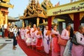 Buddhist nuns waiting for get alms in line