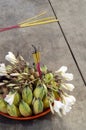 Buddhist offering bowl with incense fruit and flowers detail Royalty Free Stock Photo