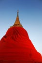 Buddhist pagoda was wrapped by textile, yellow robe.