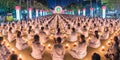 Buddhist panorama sitting hands in prayer in candlelit