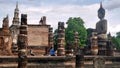 Buddhist pay respect to ruin of Buddha sculpture Royalty Free Stock Photo