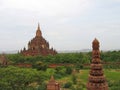 Buddhist paya in red rocks, Bagan, Myanmar Royalty Free Stock Photo