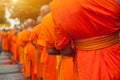 Buddhist philanthropy concept. Buddhist Monks line up in row