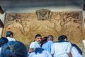 Buddhist pilgrims walking into the shrine of Sri Dalada Maligawa or the Temple of the Sacred Tooth Relic, in Kandy, Sri Lanka,