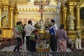 Buddhist pours water over the Buddha statue Royalty Free Stock Photo