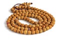 Buddhist prayer beads made of dried seeds of bird cherry, on a white background Royalty Free Stock Photo