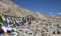 Buddhist prayer flags and stone pyramids Royalty Free Stock Photo