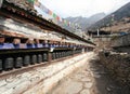 Buddhist prayer many wall with prayer wheels Royalty Free Stock Photo