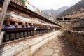 Buddhist prayer many wall with prayer wheels