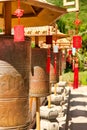 Buddhist prayer wheels in front of the temple are jade-gold statues of the goddess Guanyin in the Nanshan Buddhism Center. Hainan,