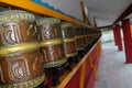 Buddhist Prayer Wheels lord buddha with Sanskrit writing with mantra Om Mani Padme Hum Royalty Free Stock Photo