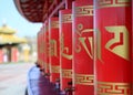 Buddhist prayer wheels of red color