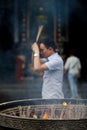 Buddhist prayers burning incense Royalty Free Stock Photo