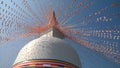 A Buddhist religion stupa in a sri Lankan temple that decorated by Buddhist flags.