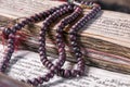 Buddhist religious japa mala on manuscript Royalty Free Stock Photo