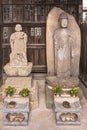 Buddhist sculptures of bodhisattva Kosodate Jizo and Buddha Shaka Nyorai in Tamonji temple.