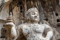 Buddhist sculptures in Fengxiangsi Cave, Luoyang, China Royalty Free Stock Photo