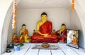 A Buddhist shrine containing numerous seated Buddha statues.