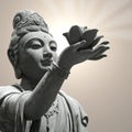 Buddhist statue holding lotus flower Royalty Free Stock Photo