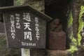 Buddhist statue at Tsutenkan tunnel in Mount Nokogiri with a poem of zen monk. Royalty Free Stock Photo