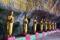 Buddhist statues row in cave Royalty Free Stock Photo